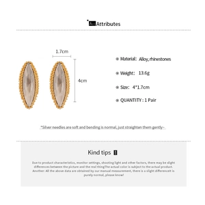 Detail view of marquise-cut champagne crystal earrings with alloy and silver needle specs