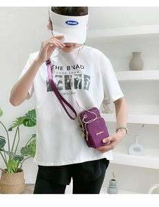 Close-up of purple nylon crossbody phone bag with multi-layer zippers and headphone port