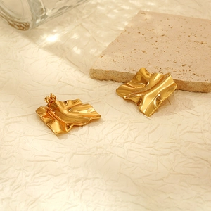 Detailed view of vintage 18K gold plated stainless steel irregular wave square earrings