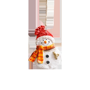 Christmas snowman ornament with red hat and golden bell for festive tree decoration