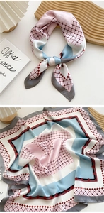 Detailed close-up of 70cm geometric silk square scarf with pastel pink and blue grid patterns