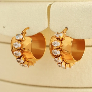 Chunky C-shaped hoop earrings plated in 18K gold with pave oval cubic zirconia accents