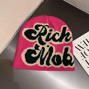 Hot pink knitted beanie hat with Rich Mob jacquard lettering for autumn winter style