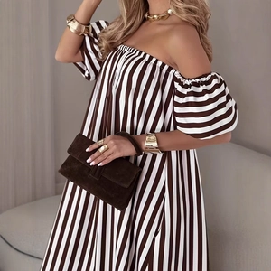 Detail of off-the-shoulder brown striped dress with elegant puffed sleeves and loose fit
