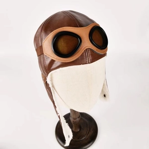 Winter bomber hat for children with warm fleece lining and pilot goggles in dark brown