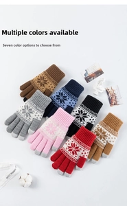Flat lay of colorful snowflake winter gloves with touch screen fingertips in seven colors