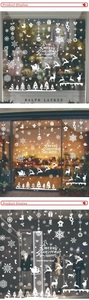 White Christmas window decals featuring snowflakes and reindeer on a festive glass display
