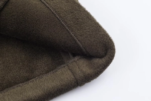 Detailed macro view of the olive brown fleece lining and durable double stitching