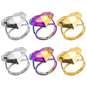 Detail view of heart-shaped geometric rings in silver, gold, and rainbow finishes