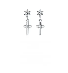 Detail of s925 silver cross drop earrings with sparkling round cubic zirconia stones