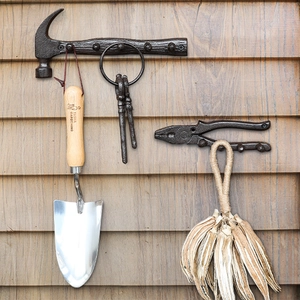 Retro cast iron wall hooks in hammer and plier shapes with vintage bronze finish