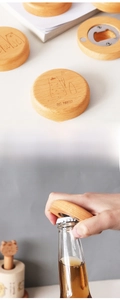 Detail view of round beech wood magnetic bottle opener with cat engraving and usage scene