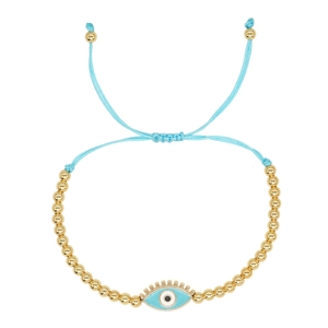 Detailed close-up of blue woven evil eye bracelet with 4mm gold beads and enamel charm