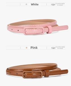 Detail of pink and brown slim patent leather belts with matching square pin buckles