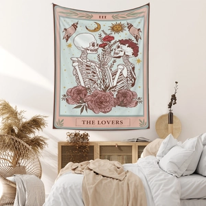 Detail of tarot card lovers skeleton tapestry hanging above bedroom bed wall