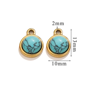 Macro detail of turquoise round pendant with gold trim showing 13x10mm dimensions
