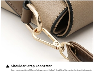 Detail of multi-layer plated gold metal buckle and lychee textured leather strap
