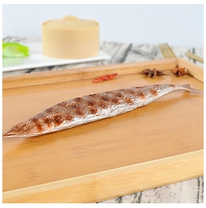 Detailed close-up of a realistic grilled saury fish model on a wooden serving tray