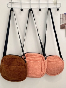 Plush sherpa crossbody bags in caramel, orange, and pink with adjustable straps