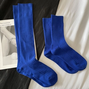 Close-up of ribbed texture and high elasticity of these blue cotton mid-calf socks