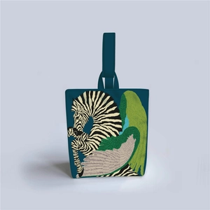 Detail of navy blue canvas tote bag featuring a artistic winged zebra illustration