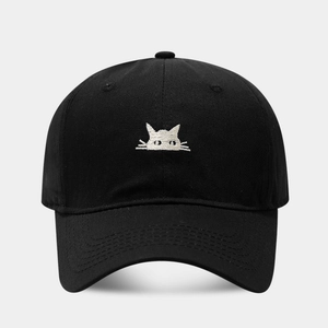 Close-up of high-quality black cotton twill baseball cap with white cat embroidery