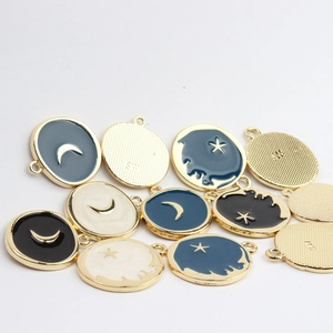 Star and moon gold-rimmed enamel charms for DIY earrings and jewelry crafting
