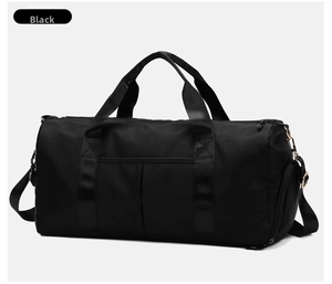 Detail of black gym bag featuring golden metal hardware and durable nylon carry straps