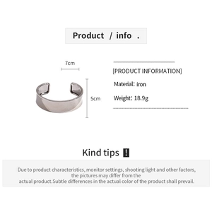 Detail view of the metallic open cuff bracelet showing 7cm diameter and 5cm width specs