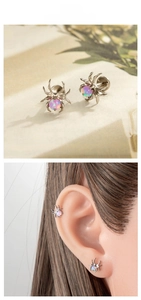 Macro detail of titanium spider labret stud with opal inlay showing ear placement