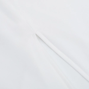 Detail view of precise stitching and high-quality mesh fabric on white bodycon dress