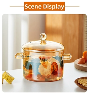 Macro detail of amber borosilicate glass pot with heat-resistant icons and vegetables