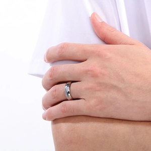 Minimalist silver-tone titanium steel plain band ring worn on hand for couples