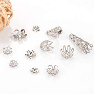 Macro detail of various stainless steel flower bead caps for DIY jewelry making