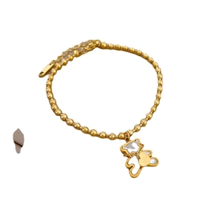 Elegant gold titanium steel bracelet with mother-of-pearl bear and heart pendant