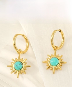 Detail of 18K gold-plated stainless steel starburst earrings with turquoise stone