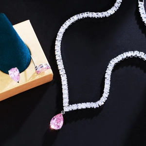 Pink teardrop gemstone necklace and earrings set in premium gift box display