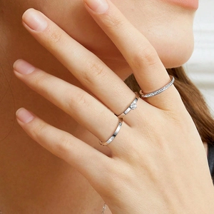 Three-piece stackable titanium steel rings with zirconia stones on model hand