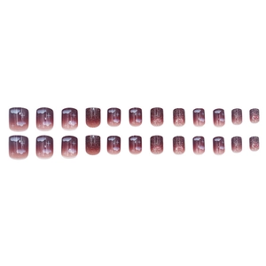 Purple gradient press-on nails with white cloud patterns and sparkling glitter finish