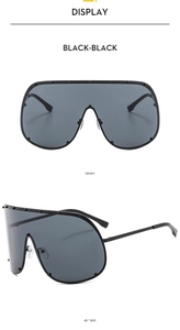 Detailed front and side views of large frame black oversized sunglasses with metal studs