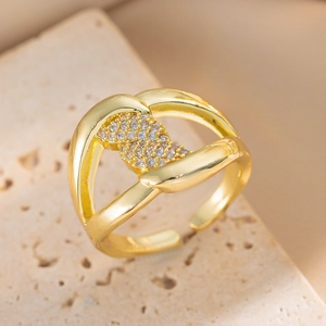 Elegant gold-plated open ring with shimmering zircon inlay on a beige stone base