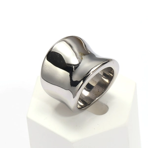 Polished silver stainless steel ring with wide inner arc on a white pedestal