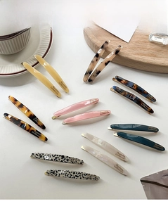 Detail of willow leaf barrettes featuring elegant metallic Barrette La France engraving