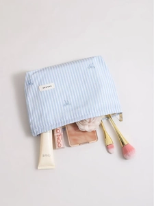 Trousse de maquillage en toile rayée bleue avec broderie nœud pour cosmétiques