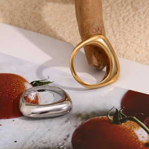 Detailed view of irregular geometric 18K gold and silver plated stainless steel rings