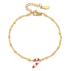 Detail of stainless steel bracelet with yellow beads and Christmas candy cane charm