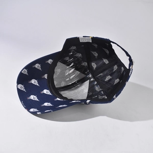 Navy blue baseball cap with white pigeon patterns, internal mesh detail view