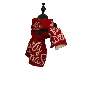 Red Christmas knit scarf featuring white snowflakes and Merry Christmas text print