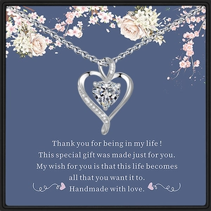 Silver heart pendant necklace with clear crystal on floral message gift card