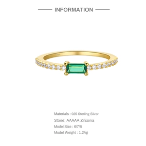 Detailed close-up of S925 sterling silver ring with emerald green zirconia and pavé stones
